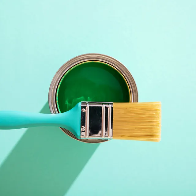 assortment painting items with green paint